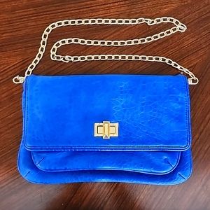 Clutch with gold shoulder chain strap